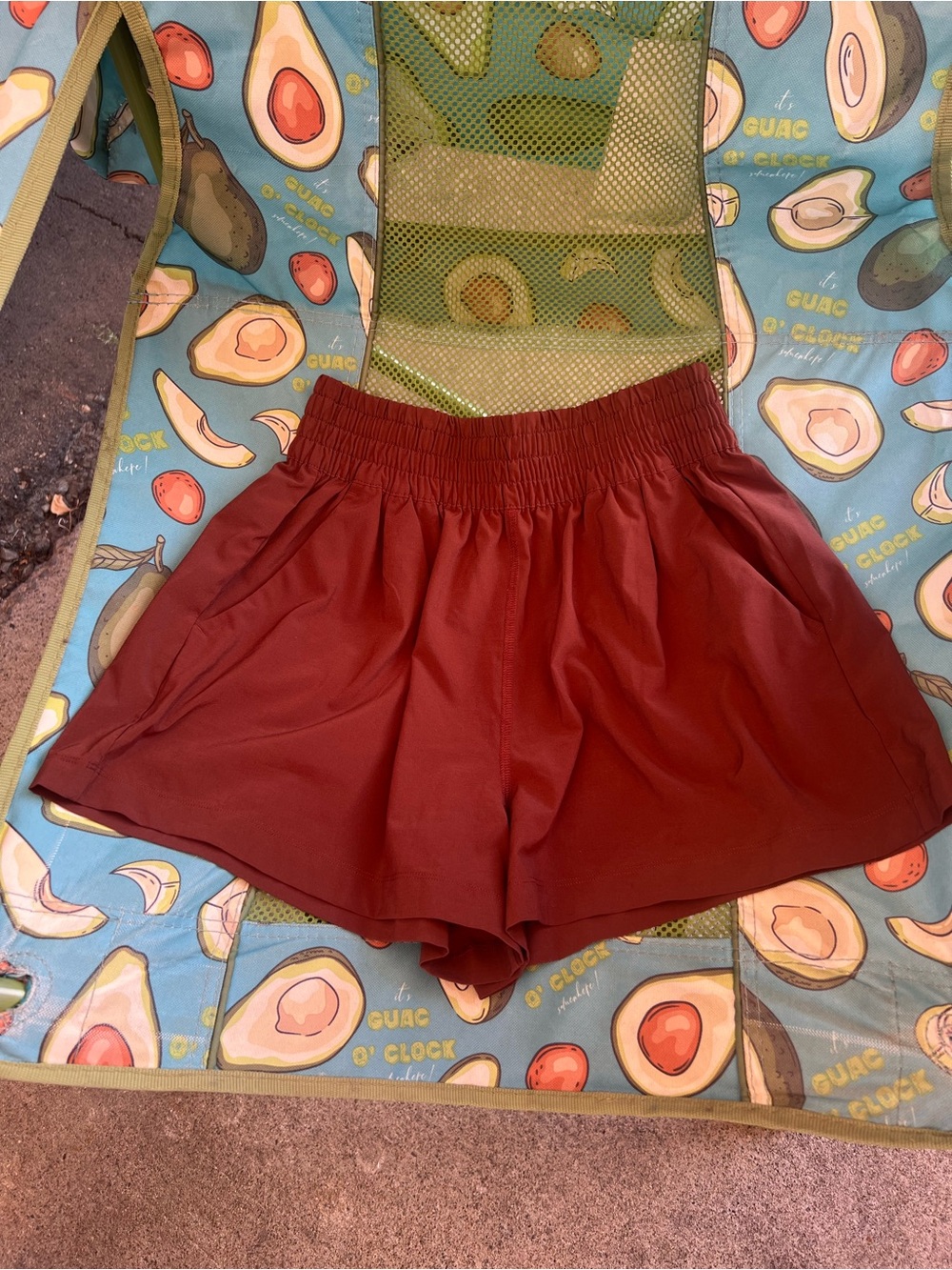 Vuori Rust Red Elastic Waist Relaxed Skort. The color is called burnt sienna